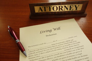 Quick Tips For Your Will First Draft - Living will - A living will document with pen and attorney name plate